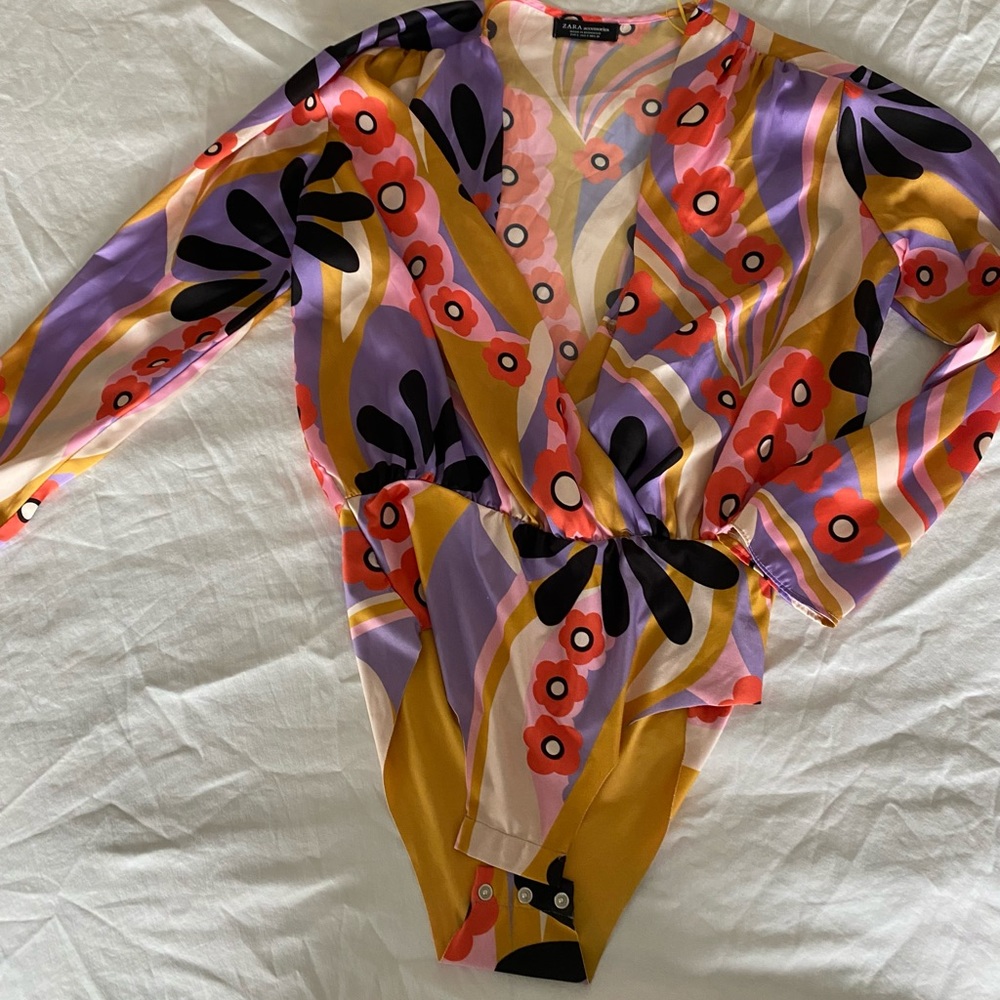 Buttery material with floral print. No front closure. Purchased from Zara